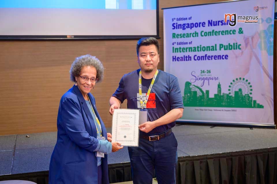Fan Yang Felicitated by Patricia M. Burrel