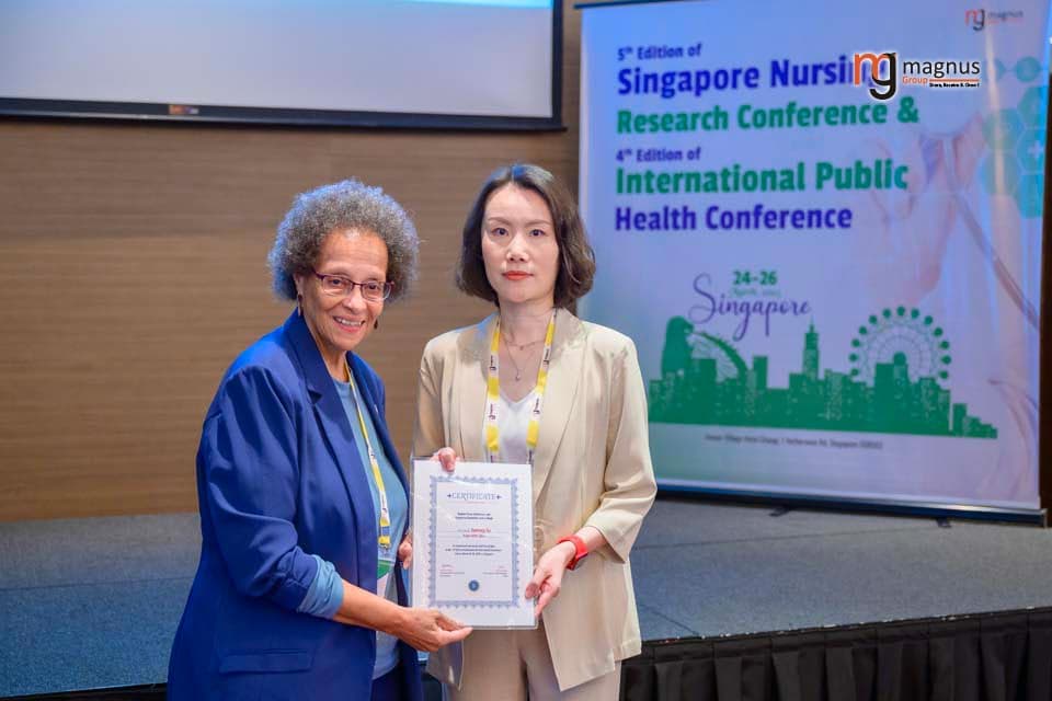Jianrong Xu Felicitated by Patricia M. Burrel
